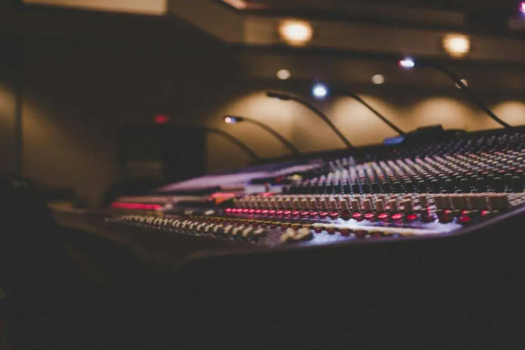 a sound mixing console in a recording studio